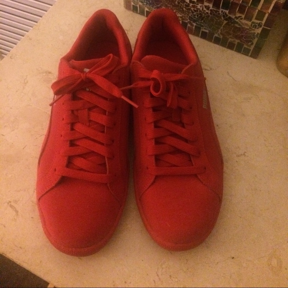 Red suede pumas